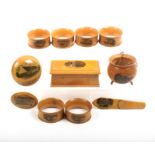 Mauchline ware - eleven pieces comprising an oval brooch (Cavendish Hotel, Grand Parade,