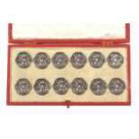 Buttons - a cased set of twelve, art nouveau style silver buttons each with a maiden's head, 2.2cm