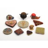 Eleven pin cushions comprising an ebony cauldron 4.5cm, an Eskimo shoe, 7cm, a velvet fan, 6cm, a