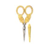 A good pair of silver gilt scissors with sheath, circa 1830, oval section tapering blades to
