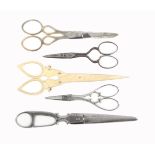 Five pairs of scissors comprising a pair of Persian style steel scissors by 'J. Rodgers and sons',