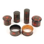 Tartan ware - six pieces, comprising a napkin ring (Caledonia), another (Indistinct), two cylinder