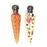 Two Victorian scent bottles comprising a cut glass example in a ruby and yellow overlay, ball form
