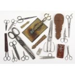 Scissors and related items comprising an Indian carved sandal wood scissor case, some losses, 20.