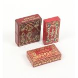 Three tooled red leather needle packet boxes comprising a rectangular example the canted lid