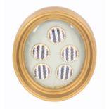 Buttons - a framed set of five 18th Century enamel buttons, probably French, in alternate stripes of