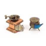 Two novelty tape measures, comprising a brass cauldron, complete tape in inches and centimetres