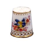 A late 19th Century porcelain thimble, Worcester, well painted with a bird on a flowering branch and