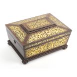 A rosewood and brass inlaid sewing box of sarcophagal form, circa 1835, the lid and front with cut