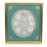 Buttons - a framed display, containing a set of six 18th Century Copenhagen ceramic buttons with