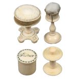A mixed lot - sewing - four 19th Century ivory pieces comprising a circular table form pin cushion