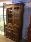 An Old Charm oak linenfold cabinet