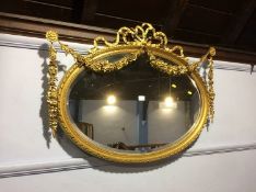 An ornate gilt foliate mirror