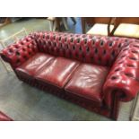 A Chesterfield Oxblood three seater settee