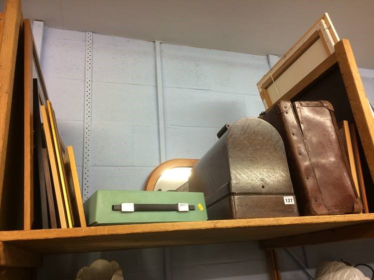 Shelf of assorted including sewing machine