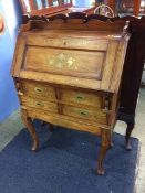 Campaign style bureau with brass inlay