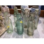 Six glass bottles including; Parkers, Bradford and District, Bowness's Ltd, John Martin, Harry
