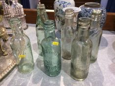 Six glass bottles including; Parkers, Bradford and District, Bowness's Ltd, John Martin, Harry