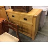 A small light oak cabinet