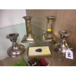 Two pairs of silver candlesticks