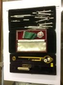 A cased planimeter, drawing set etc.