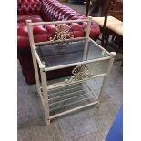 A pair of metalwork and glass side tables