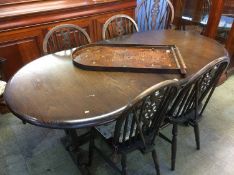 Oak dining table and six Windsor chairs
