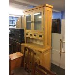 A light oak kitchen dresser