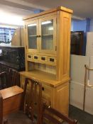 A light oak kitchen dresser