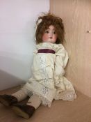 A Bisque headed doll