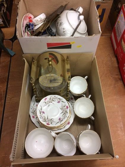 Two boxes including tea china, clock etc.