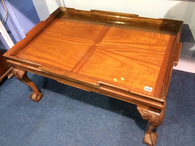 Reproduction mahogany claw and ball coffee table