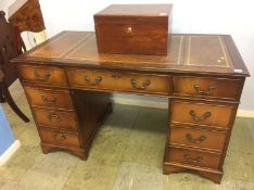 A reproduction mahogany pedestal desk