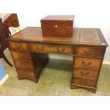 A reproduction mahogany pedestal desk