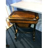 A late Victorian burr walnut and ebonised work table, with single drawer and solid pull out bag