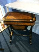 A late Victorian burr walnut and ebonised work table, with single drawer and solid pull out bag