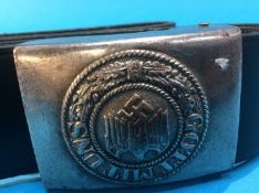 A leather belt, the metal buckle stamped 'Gott Mituns'