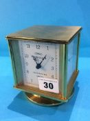 A brass cased desk clock and barometer, dial signed Sewills, Liverpool