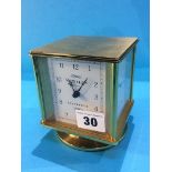 A brass cased desk clock and barometer, dial signed Sewills, Liverpool