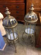 Pair of brass and glass lanterns on stands