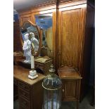 An Edwardian breakfront triple door wardrobe with matching dressing chest and bedside cabinet