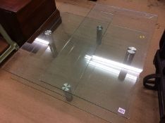 A glass three tier occasional table