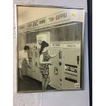 A framed black and white photograph of two ladies using vending machines