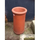 A terracotta chimney pot