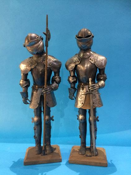 A pair of mini suits of armour