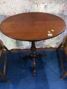 A 19th century mahogany oval top tripod table