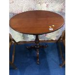 A 19th century mahogany oval top tripod table