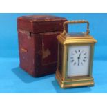 A small brass cased travelling carriage clock, together with fitted leather case