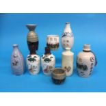 A pair of Japanese World War II sake bottles, a Pacific War commemorative bottle, a 16th and 28th
