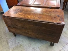 A Georgian oak gate leg dining table